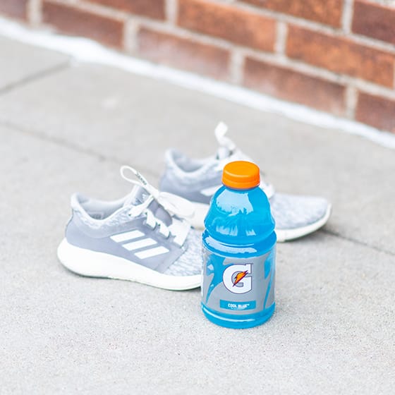 Gatorade Bottle next to sneakers