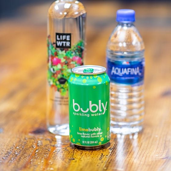Life Wtr, bubly, and. Aquafina drinks on a table